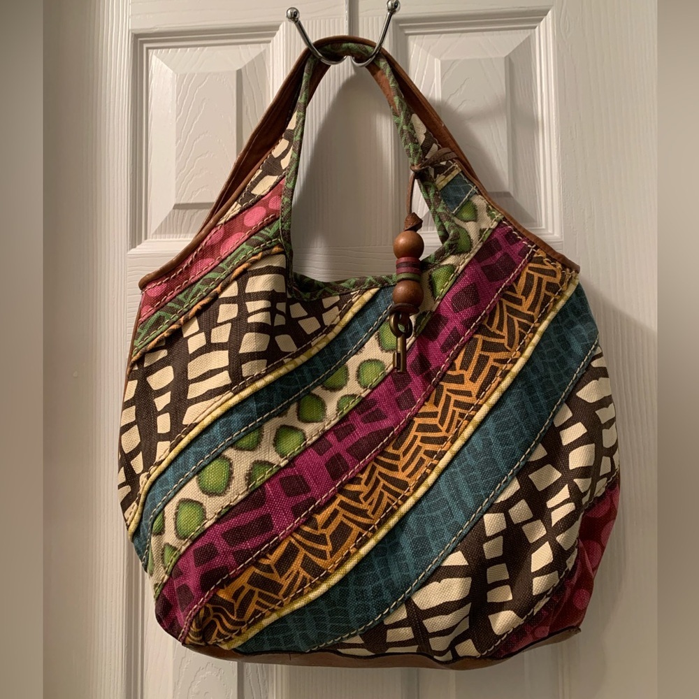 Fossil colorful canvas shoulder bag with vegan leather trim.